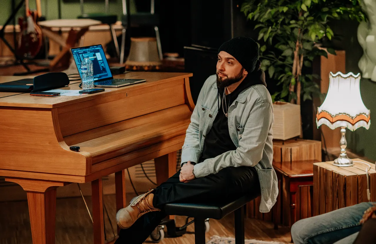 A studio moment with the LUNA STUDIOS founding team beside a piano